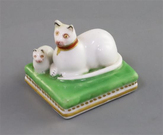 A small Chamberlain Worcester group of a recumbent white cat and kitten, c.1820-40, L. 4.3cm, restoration to ears